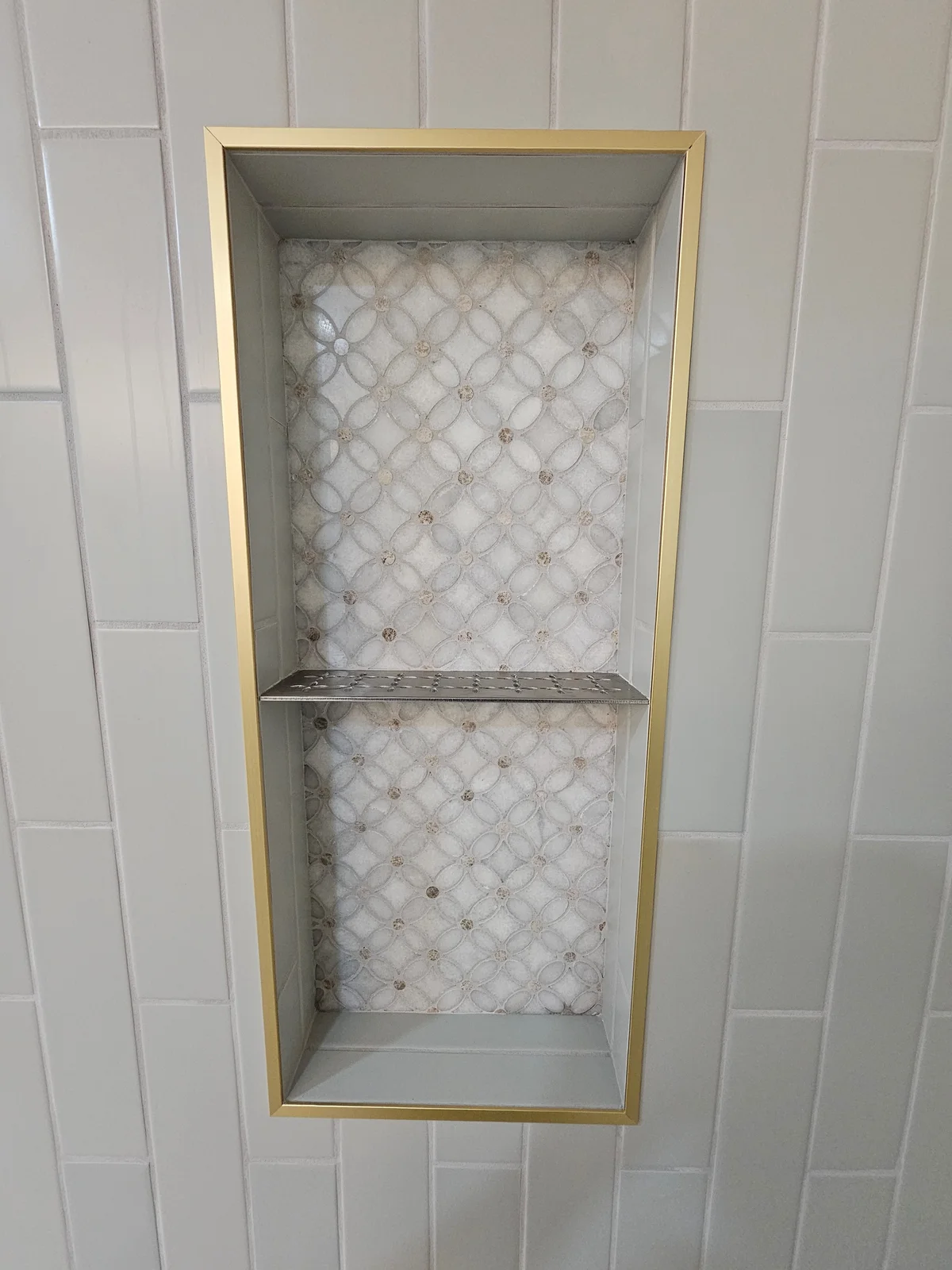 Finished Evansville bathroom remodel with dark green double vanity, arched mirrors, brass sconces, and freestanding tub - photo 3