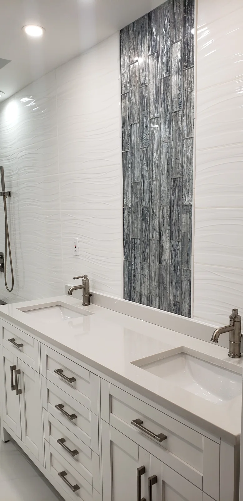 Finished Newburgh bathroom remodel with white tub-shower combo, gray accent tile wall, recessed lights, and white vanity - photo 1